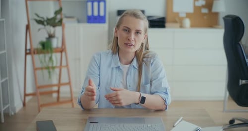 Woman Having Video Call Online Meeting In Office