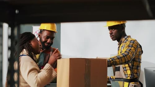 Warehouse Workers Collaborating During Inventory Inspection