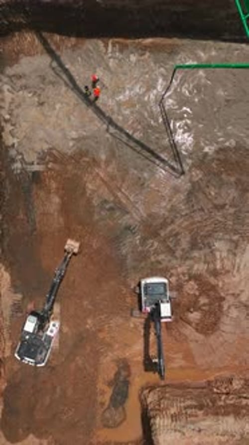 Vertical Video Workers Use Heavy Machinery to Build MultiStory Buildings