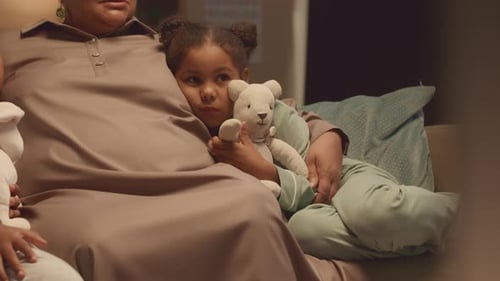 Grandmother and Children Together at Home in Evening