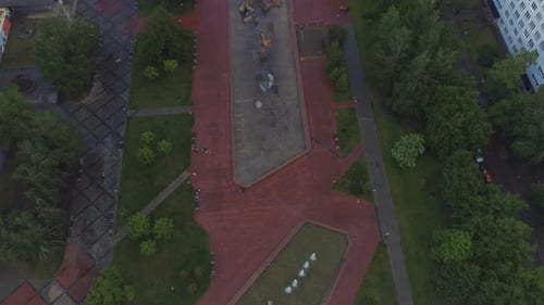 Large City Park with Fountains Against Cloudy Sky
