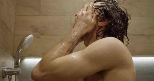 Man Enjoying Refreshing Shower, Washing Hair