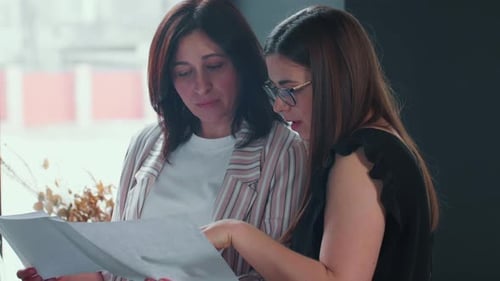 Women Reviewing Documents in an Office