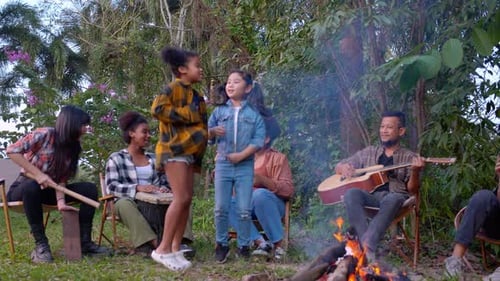 Friends Gather Around Campfire, Two Children Dancing
