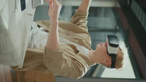 Young Adult Immersed in Virtual Reality with Headset