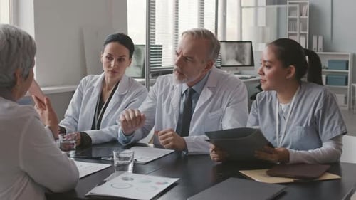 Medical Professionals Meeting in Brightly Lit Office