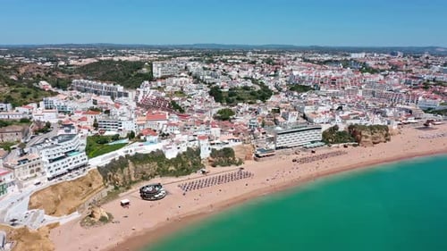 Albufeira Cityscape and Coastline Showing White Buildings Beaches Turquoise Waters and Tourists