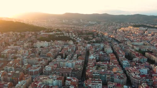 Barcelona city skyline at sunset, aerial view of Guinardo and La Font d'en Fargues, Catalonia, Spain