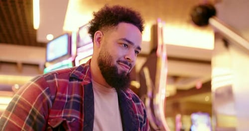 A Happy Casino Moment with a Smiling Young Man Enjoying Fun Activities and Experiences