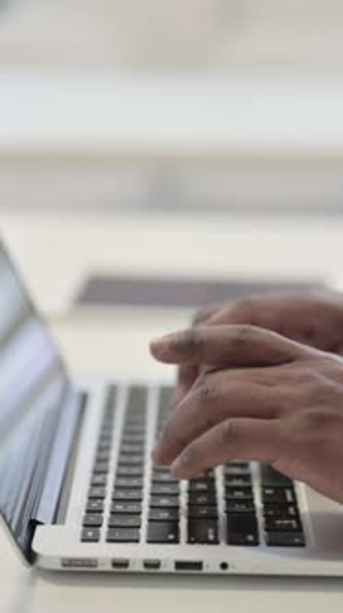 Side View of Hands of Businessman Typing on Laptop, Close up, Vertical Video