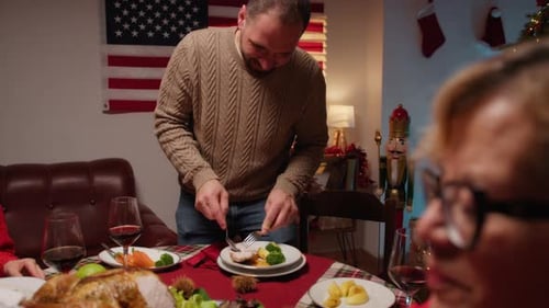 Man Serving Roasted Turkey for Thanksgiving