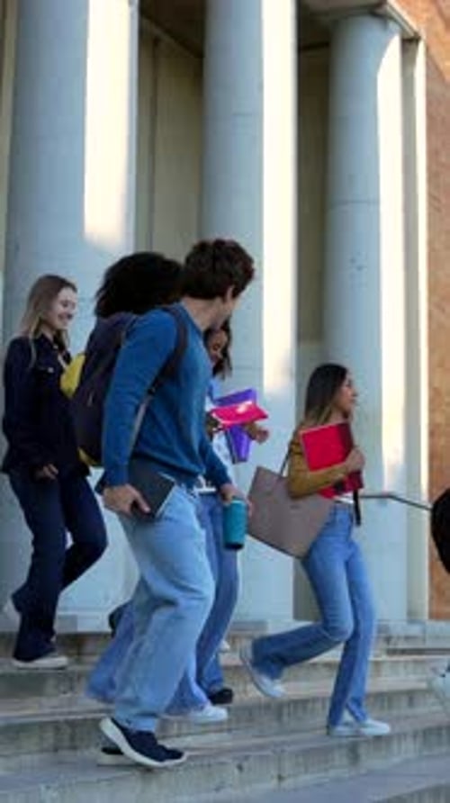 Diverse Group of University Students Walking Downstairs