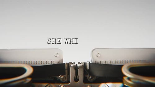 Old mechanical typewriter typing She Whispered Goodbye in a close-up view.