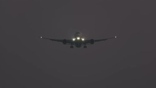 Plane Flying Towards Camera at Night