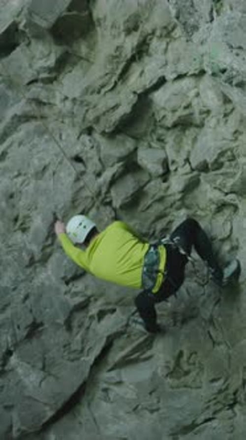 Extreme Sports Active Alpinist Male Sportsman Climbing Down the Mountain Cliff Limestone Rock