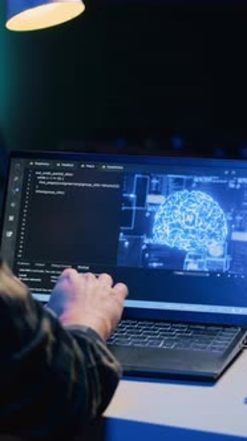 Vertical Video Teleworking IT Specialist in Apartment Office Uses Programming to Upgrade AI