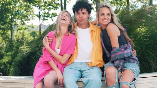 Man and two women outdoors
