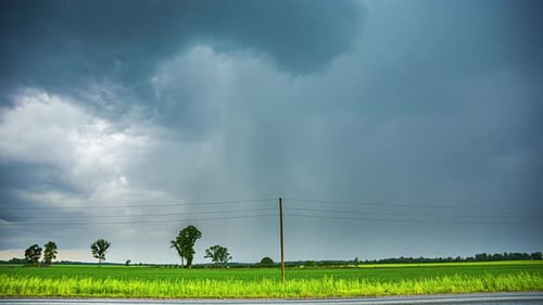 Powerful rainstorm watering agriculture fields, time lapse view