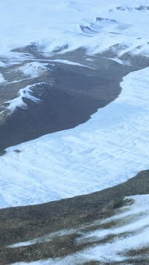 Snow Covered Mountain Range Seen From Above