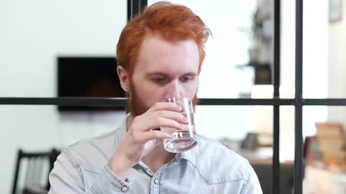Portrait of Man Drinking Water
