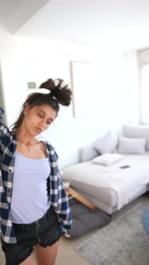 Young Woman Dancing in a Bright Living Room