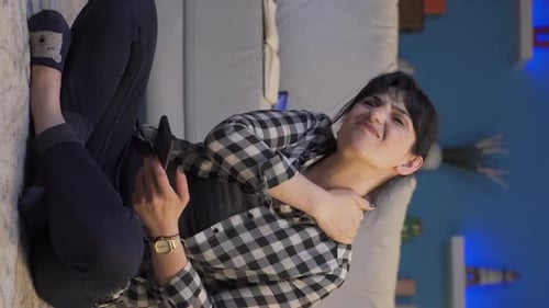 Woman Massaging Stiff Neck While Using Phone