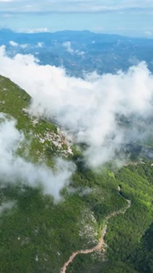 Vertical Video Aerial Adventure Through CloudKissed Mountain Peaks Nature's Majesty Unveiled