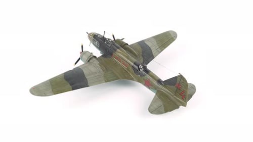Model Airplane with Camouflage Paint and Red Star