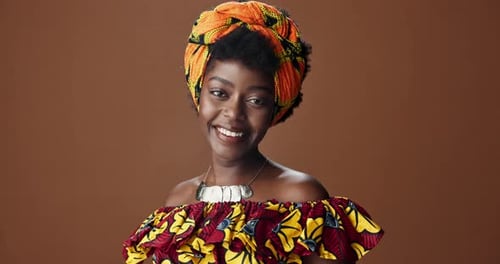 Wrap, fashion or face of happy black woman in studio on a brown background for trendy style