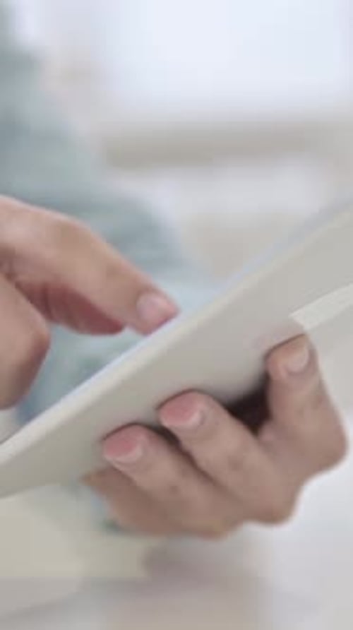 Close Up of Man Using Tablet, vertical video