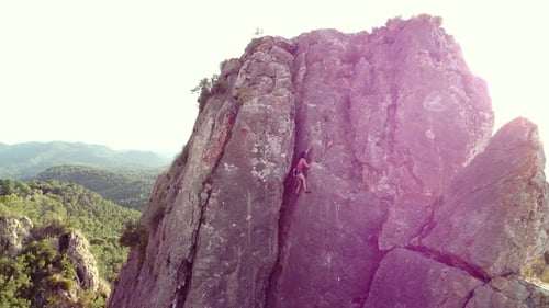 Climbing woman in the mountain. Drone view of climber sportsmen.Physical activity in the countryside