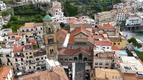 Drone shot of St. Andrew Cathedral's facade in Amalfi, Salerno, Campania, Italy