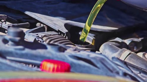 Adding Fluid To Car Motor Close Up