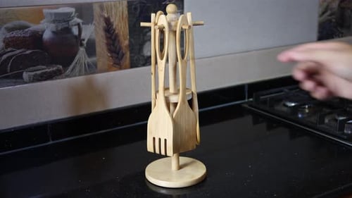 Wooden Utensil Set on Dark Kitchen Counter