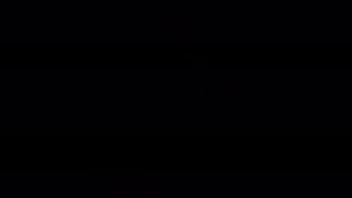 Full Moon Shines Through Light Clouds at Night