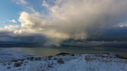 Timelapse of clouds moving through the sky in winter landscape