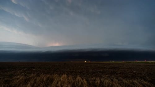 Storm Clouds and Lightning over Dark Field