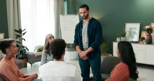 Therapy circle, support group and man with people in meeting, conversation and talking