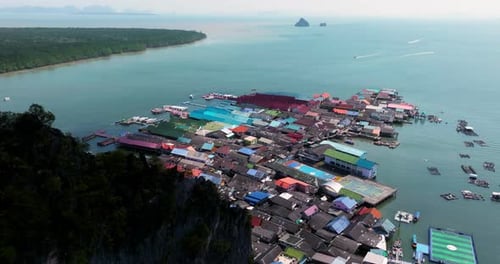 Koh Panyee Floating Village And Blue Sea In Phang Nga Bay, Thailand. - aerial shot