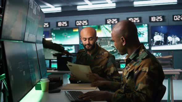 Teamworking Military Agents Look at Intel Folder Files, Technology ...