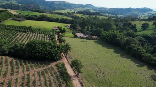 aerial view of man riding a motocross on an off road trail, a typical activity in the countryside of