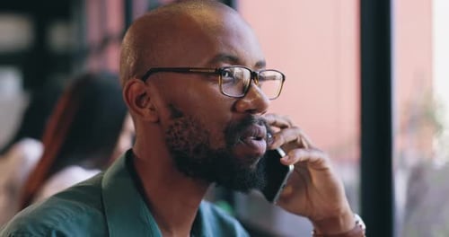 Face, phone call and black man employee in office for communication, networking or negotiation