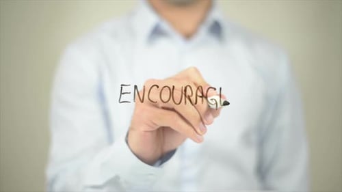 Encourage Man Writing on Transparent Screen