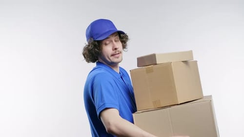 Postal Courier Man with Heavy Parcels Boxes Postman Delivers Address Package on White Studio
