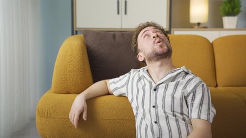 Casual happy young man at home.