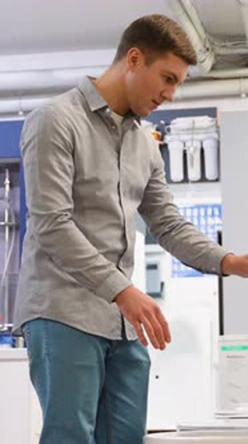 A Man Chooses Ceramic Tiles in a Hardware Store Vertical Video