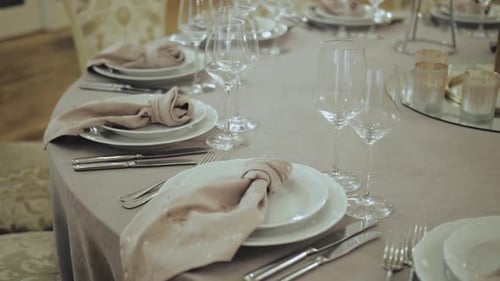 Bride and Groom Place Settings at Wedding Reception Table Closeup Beautiful Plates with a Gold