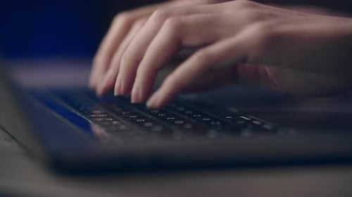 Closeup of Hands Typing on Laptop Keyboard Emphasizing Technology and Productivity in Office