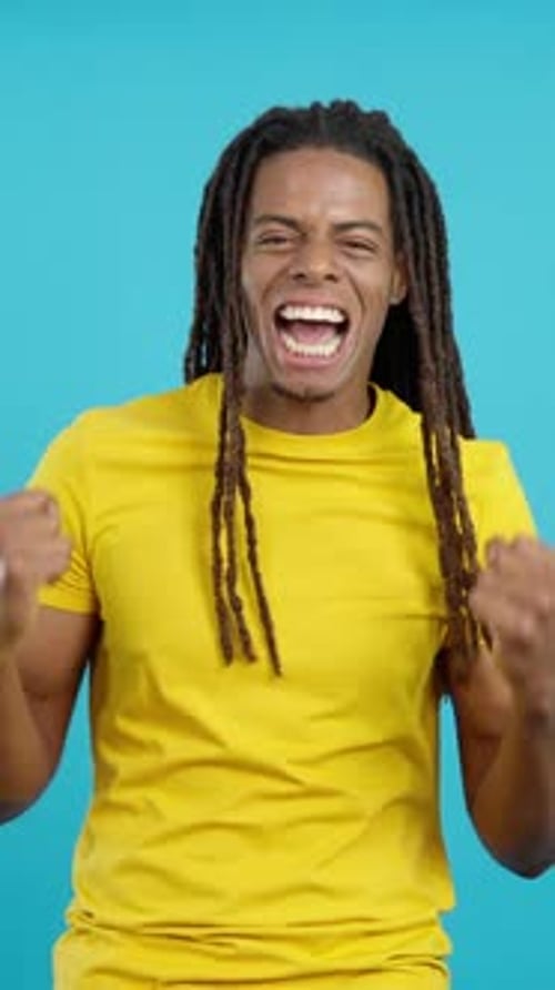 Man Celebrating Success in a Vertical Portrait