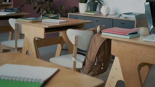 Empty Classroom with Desks and Books